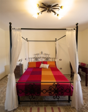 Camera melograno letto matrimoniale